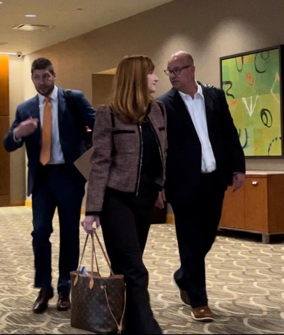 Former Tennessee coach Jeremy Pruitt and his wife, Casey, arrive at an NCAA infractions hearing in Cincinnati on April 19, 2023.