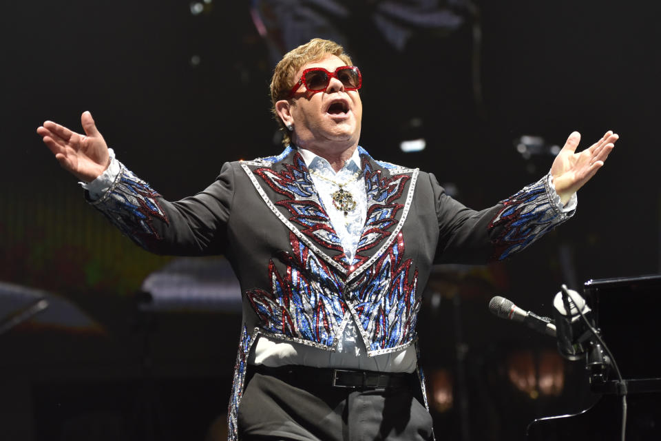 FILE - Elton John performs during his Elton John Farewell Yellow Brick Road tour in Rosemont, Ill. on Feb 15, 2019. Elton John has announced the final dates for his farewell tour, which includes stops at big stadiums in the U.S. (Photo by Rob Grabowski/Invision/AP, File)