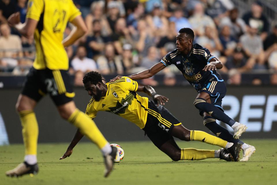 Aug 28, 2024; Philadelphia, Pennsylvania, USA; Columbus Crew midfielder Derrick Jones (5) plays the ball defended by Philadelphia Union midfielder Danley Jean Jacques (21) in the first half at Subaru Park. Mandatory Credit: Caean Couto-USA TODAY Sports