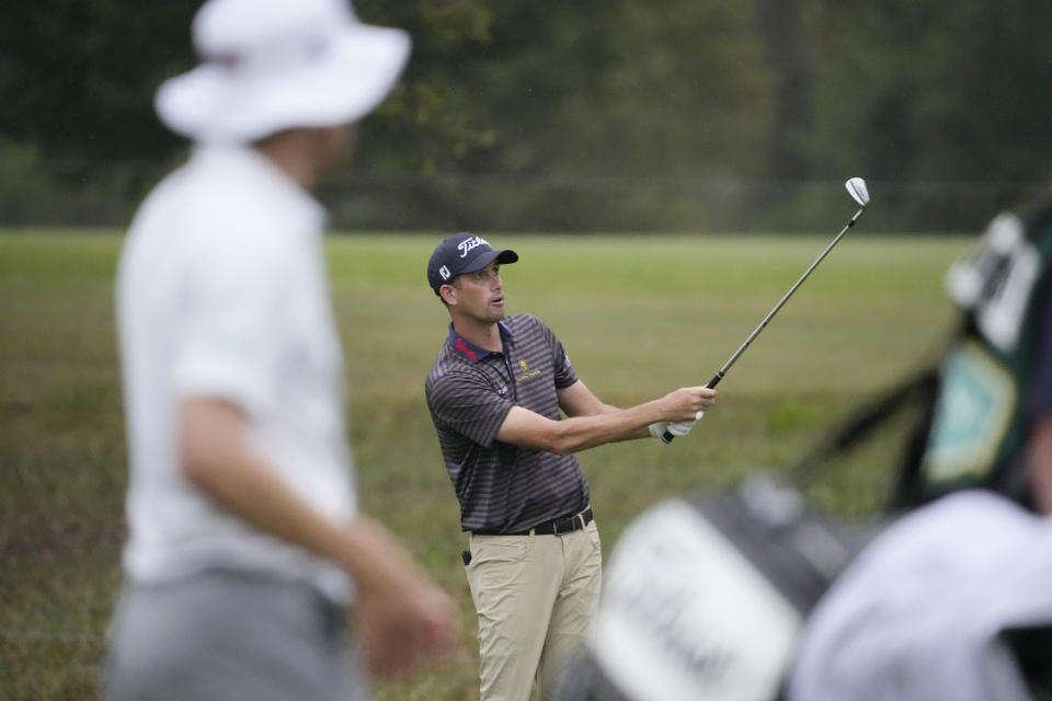 Chesson Hadley, center, watches his shot from the eighth fairway, while Peter Malnati watches in the foreground during the first round of the Sanderson Farms Championship golf tournament in Jackson, Miss., Thursday, Oct. 5, 2023. (AP Photo Rogelio V. Solis)