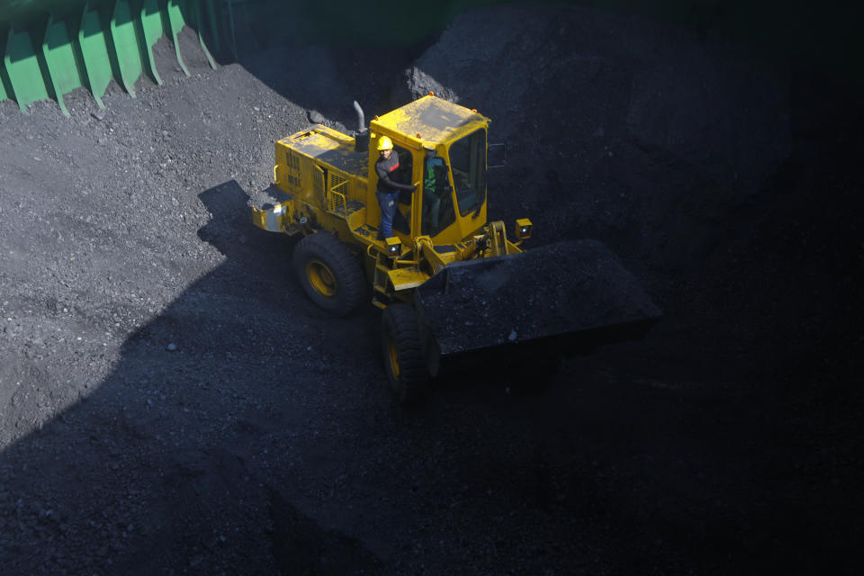 Coal is being unloaded from a ship for the Maitree Super Thermal Power Project near the Sundarbans, the world’s largest mangrove forest, in Rampal, Bangladesh, Monday, Oct. 17, 2022. A power plant will start burning coal as part of Bangladesh’s plan to meet its energy needs and improve living standards, officials say. (AP Photo/ Al-emrun Garjon)