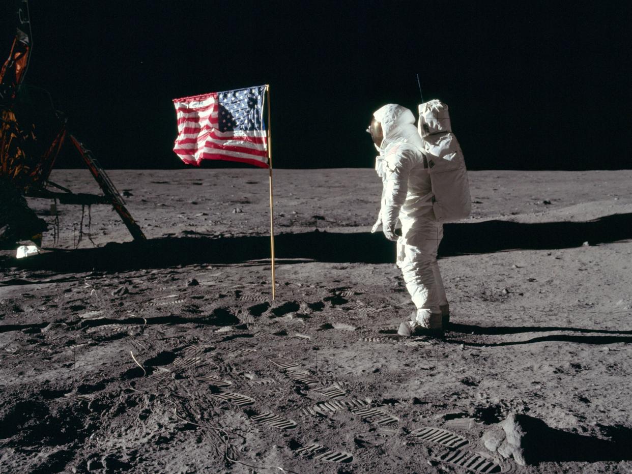 Buzz Aldrin salutes the first American flag erected on the Moon, July 21, 1969