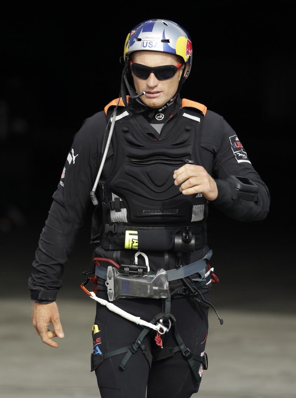 Oracle Team USA skipper Jimmy Spithill walks out of the team's base and heads for his boat during training for the America's Cup, Wednesday, July 3, 2013, in San Francisco. Opening ceremonies for the sailing event are scheduled for Thursday. (AP Photo/Eric Risberg)