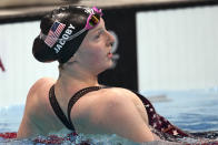 Lydia Jacoby of the United States leans on a lane rope after winning the final of the women's 100-meter breaststroke at the 2020 Summer Olympics, Tuesday, July 27, 2021, in Tokyo, Japan. (AP Photo/Matthias Schrader)