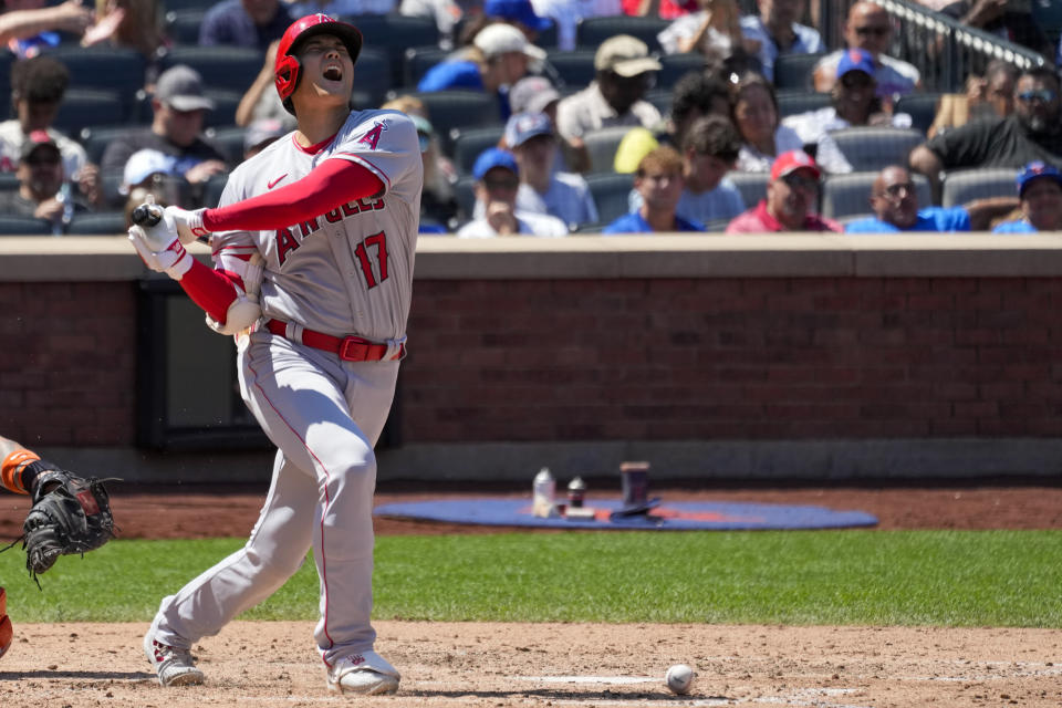 Los Angeles Angels designated hitter Shohei Ohtani reacts after foul tipping the ball off his foot during the sixth inning of a baseball game against the New York Mets, Sunday, Aug. 27, 2023, in New York. (AP Photo/Mary Altaffer)