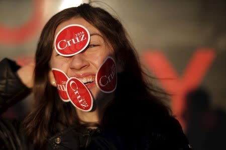 Delaney Anne poses for photographs with stickers on her face following a campaign stop by U.S. Republican presidential candidate and U.S. Senator Ted Cruz at the Tilt'n Diner in Tilton, New Hampshire January 18, 2016. REUTERS/Brian Snyder