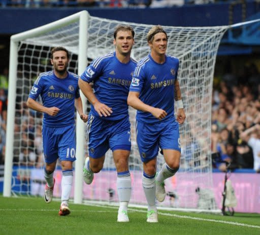 Chelsea's Fernando Torres (R) celebrates scoring a goal with teammates Branislav Ivanovic (2nd L) and Juan Mata during their English Premier League match vs Newcastle United at Stamford Bridge in London, on August 25. Table-toppers Chelsea, the Champions League holders, make the short journey to local rivals QPR next, on Saturday