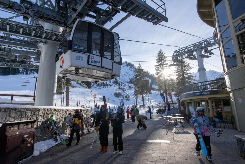 Skiers and snowboarders finish a run at Palisades Tahoe on Thursday, Jan. 11, 2024, in Placer County. A skier died after an avalanche on Wednesday.