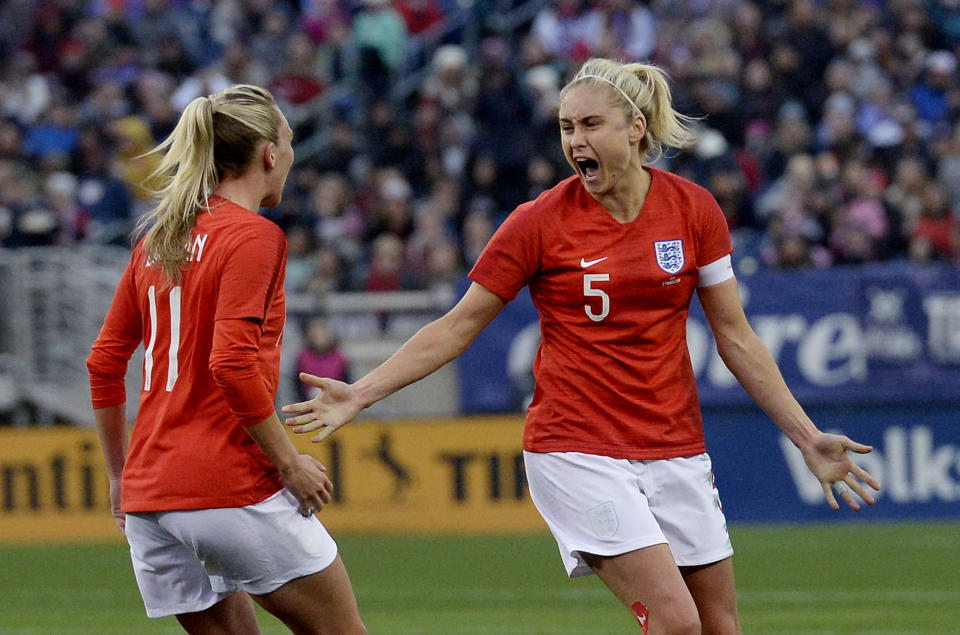 England defender Stephanie Houghton (5) celebrates with forward Toni Duggan (11) after Houghton scored a goal against the United State during the first half of a SheBelieves Cup women's soccer match Saturday, March 2, 2019, in Nashville, Tenn. (AP Photo/Mark Zaleski)