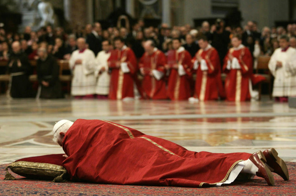 FILE - Pope Benedict XVI lies on the ground before the altar during a Good Friday ceremony for the Passion of Christ, inside St. Peter's Basilica at the Vatican, Friday, April 6, 2007. (AP Photo/Danilo Schiavella, Pool, File)