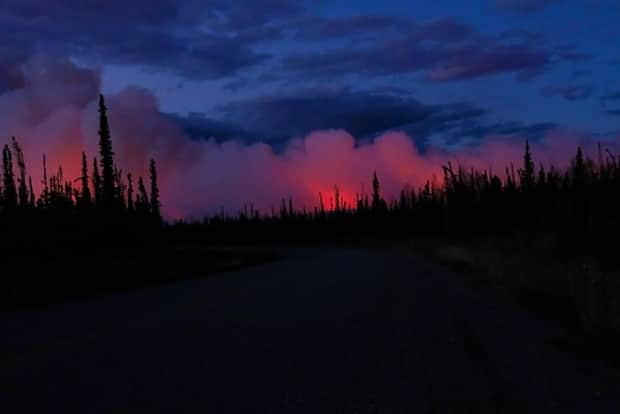 Smoke from a wildfire near Stewart Crossing, Yukon, in 2019. Many parts of central Yukon are under a moderate to extreme fire danger rating heading into the weekend. (Submitted by Claus Vogel - image credit)