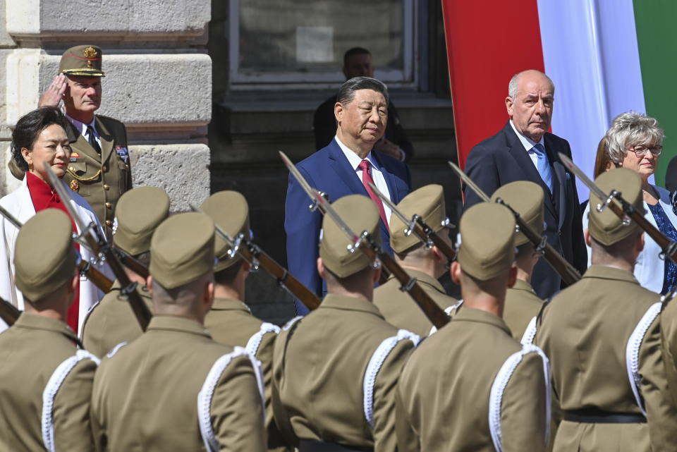 Hungarian President Tamas Sulyok, rear right, receives Chinese President Xi Jinping, rear left, with military honours in the Lion Court of the Castle of Buda in Budapest, Thursday, May 9, 2024. (Zoltan Mathe/MTI via AP)