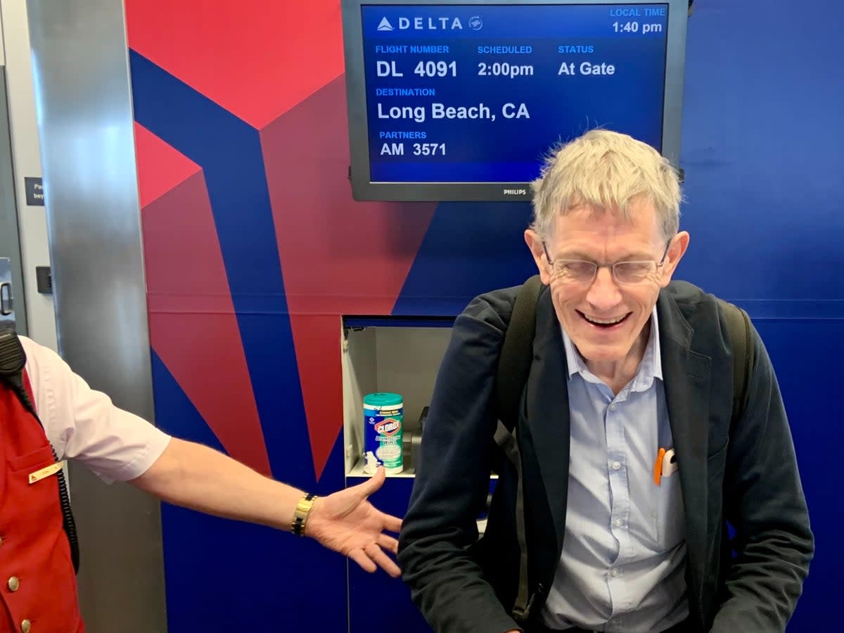 Happy chap: Simon Calder after learning his Delta flight from Salt Lake City to Long Beach is overbooked, and being offered $600 to travel on a later departure (Douglas Bolton)