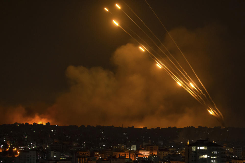 Rockets are fired toward Israel from the Gaza Strip, Sunday, Oct. 8, 2023. The militant Hamas rulers of the Gaza Strip carried out an unprecedented, multi-front attack on Israel at daybreak Saturday, firing thousands of rockets as dozens of Hamas fighters infiltrated the heavily fortified border in several locations, killing hundreds and taking captives. Palestinian health officials reported scores of deaths from Israeli airstrikes in Gaza. (AP Photo/Fatima Shbair)