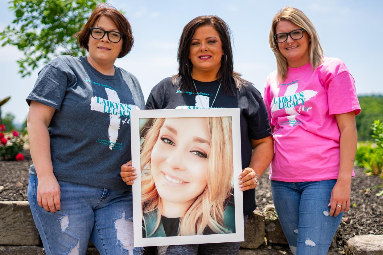 Holding a photo of Laikyn Wisecarver, Jodi Niceswanger vows to keep her daughter's story alive. With the help of Monica Batteiger (left) and Heaven Smitley (right), she plans to help others struggling with addiction.