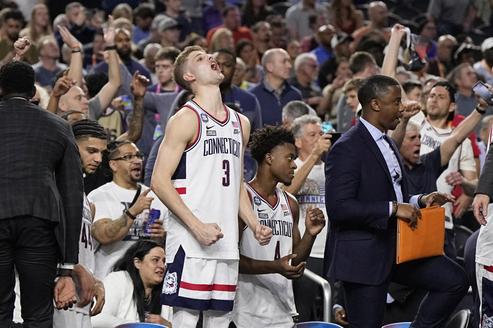 Connecticut guard Joey Calcaterra celebrates after their win against Miami in a Final Four college basketball game in the NCAA Tournament on Saturday, April 1, 2023, in Houston. (AP Photo/Brynn Anderson)