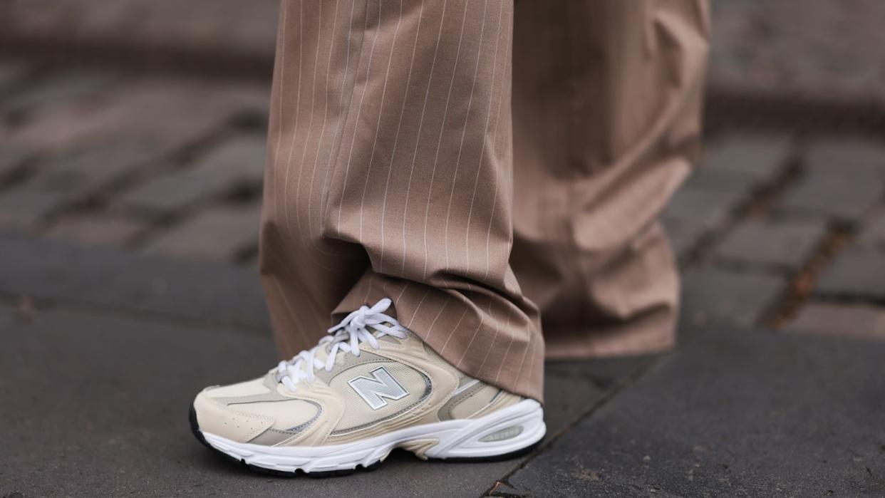 a person's legs and shoes new balances