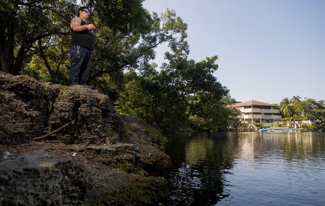 Luis Pujol, 32, a Little Havana resident, fishes in the Coral Gables Waterway near Cocoplum Circle.