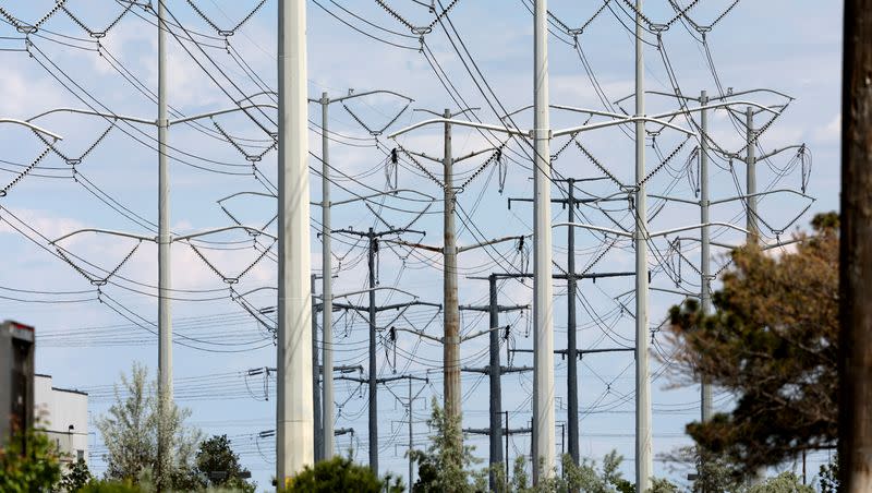 High-tension power lines run along Wright Brothers Drive near the Salt Lake City International Airport in Salt Lake City on May 24, 2022.