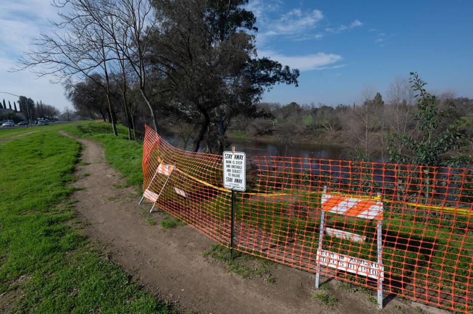 The city has put up warnings about the unsafe nature of the river bank of the Tuolumne River along Crater Avenue in Modestoon Tuesday, Jan. 30.