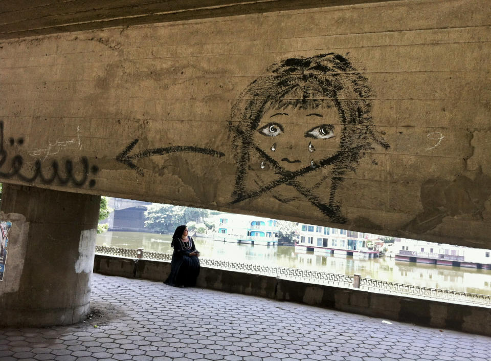 This May 4, 2012 photo shows graffiti of a girl under a bridge in the upscale Zamalek neighborhood in Cairo, Egypt. Women activists say they won a major step forward with Egypt’s new constitution, which enshrined greater rights for women. But months after its passage, they’re worrying whether those rights will be implemented or will turn out to be merely ink on paper. Men hold an overwhelming lock on decision-making and are doing little to bring equality, activists say, and the increasingly repressive political climate is stifling chances for reforms. (AP Photo/Maya Alleruzzo)