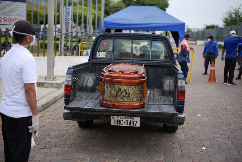 A coffin is seen on the back of a truck outside Guasmo Sur General Hospital after Ecuador reported new cases of coronavirus disease (COVID-19), in Guayaquil