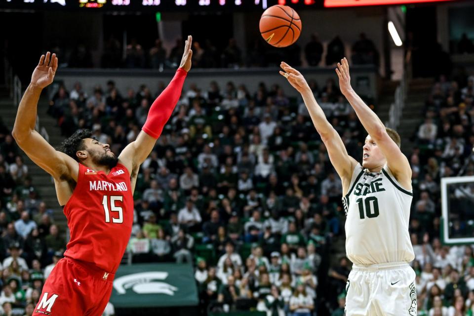 Michigan State's Joey Hauser, right, is fouled by Maryland's Patrick Emilien on a 3-pointer attempt during the second half on Tuesday, Feb. 7, 2023, at the Breslin Center in East Lansing.