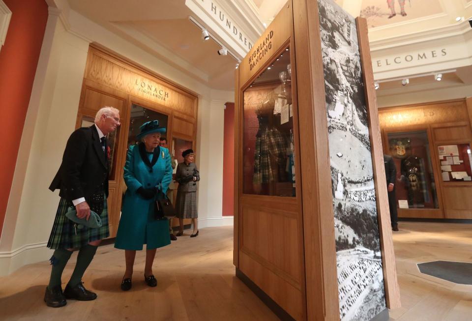 8) The Queen tours the exhibits in the Duke of Rothesay Highland Games Pavilion