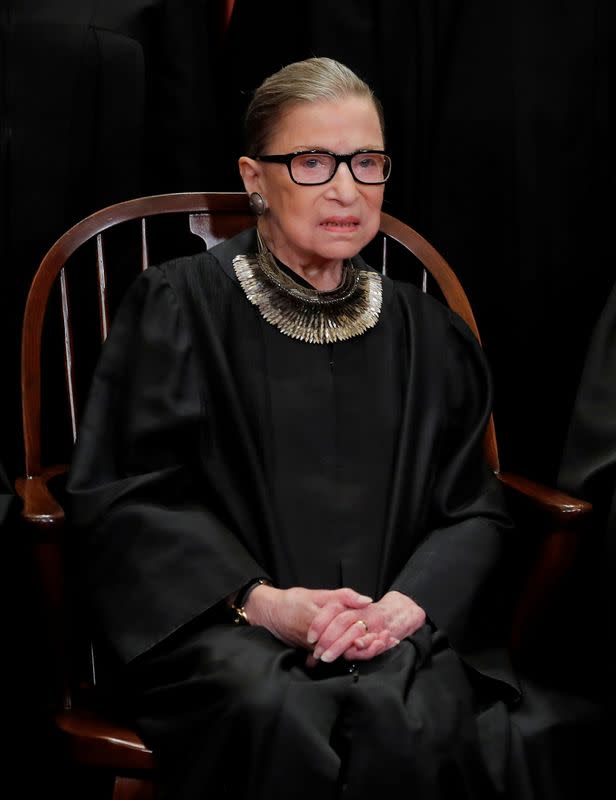 FILE PHOTO: U.S. Supreme Court Justice Ruth Bader Ginsburg poses during group portrait at Supreme Court in Washington