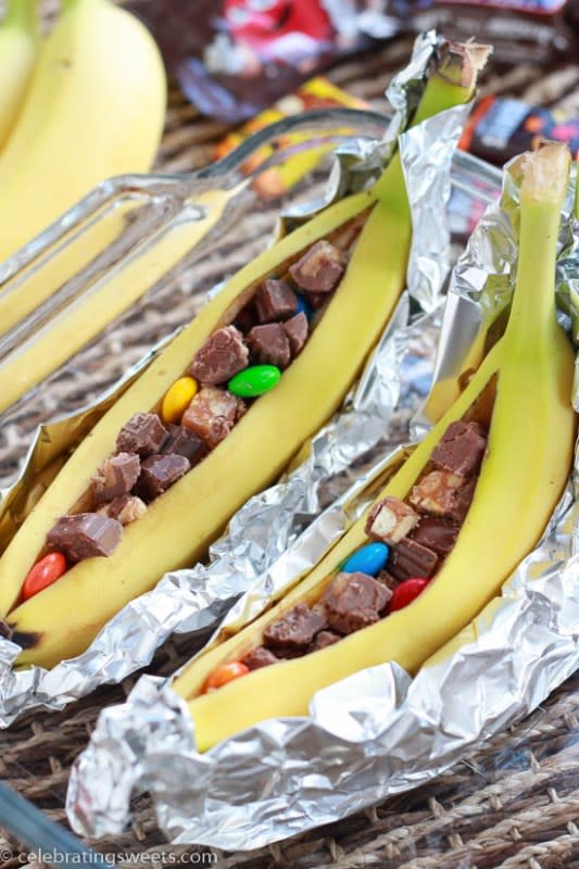 <p>Celebrating Sweets</p><p>Roasted bananas stuffed with chocolate candy bars. Similar to the traditional campfire treat, but even better!</p><p><strong>Get the recipe: <a href="https://celebratingsweets.com/candy-bar-banana-boats/" rel="nofollow noopener" target="_blank" data-ylk="slk:Candy Bar Banana Boats;elm:context_link;itc:0;sec:content-canvas" class="link ">Candy Bar Banana Boats</a></strong></p>