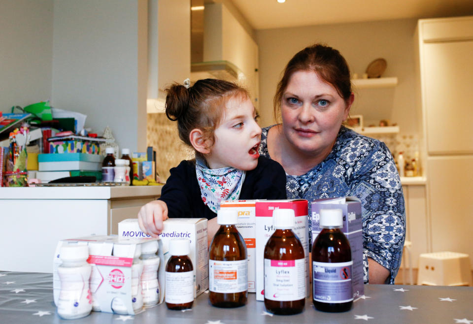 Jo Elgarf is seen with her daughter Nora and the child's prescription medicine at their home in London, Britain, January 30, 2019. Picture taken January 30, 2019. REUTERS/Henry Nicholls