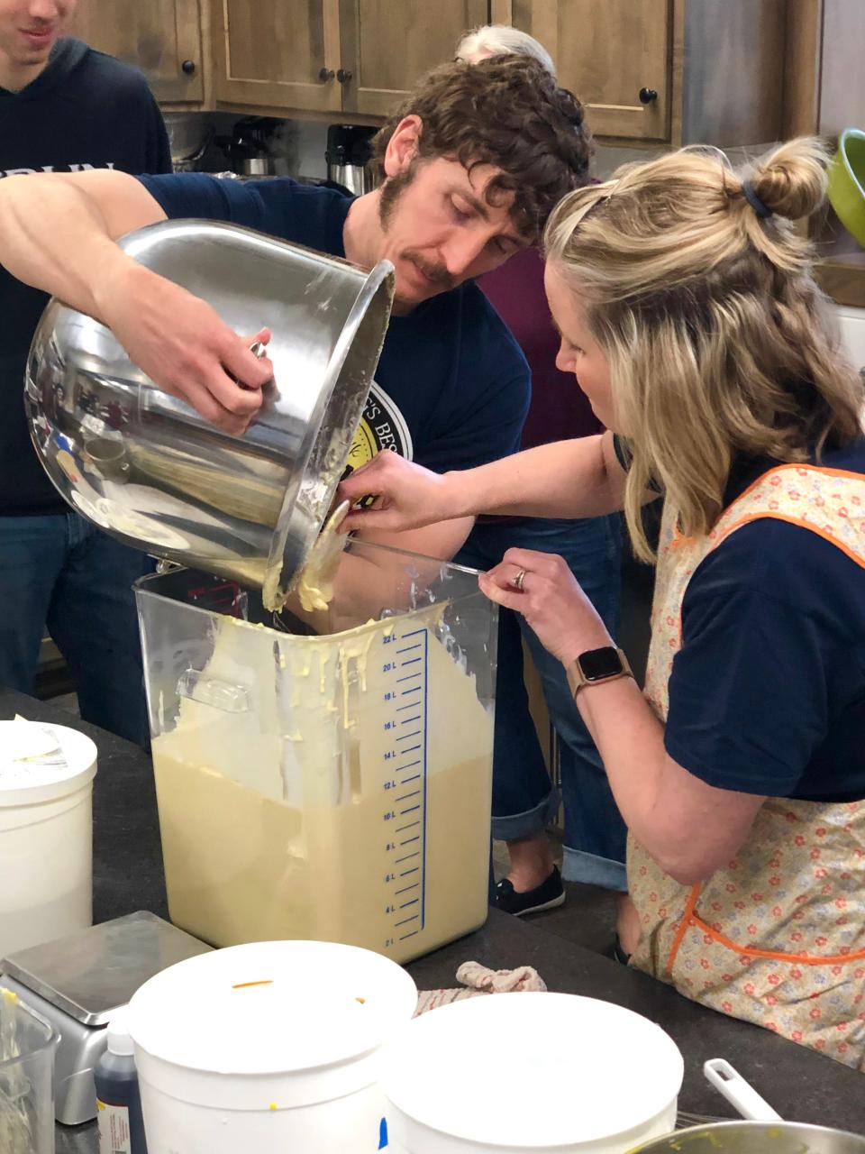 Michele and Jeremy Patterson mix pancake batter at a previous Maple Syrup Missions Festival at Sonnenberg Mennonite Church in Kidron. This year's event is April 20.