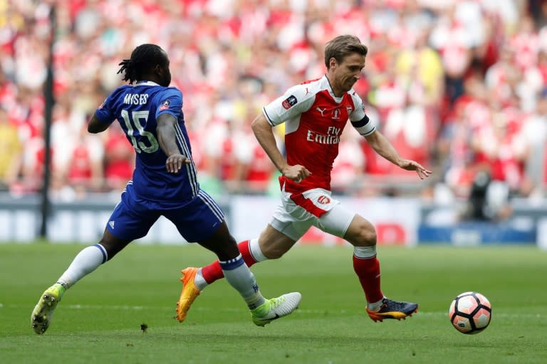 Arsenal's Nacho Monreal (R) vies with Chelsea's Victor Moses (L) at Wembley stadium in London on May 27, 2017