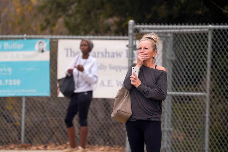 Spectators react near the scene of a helicopter crash that reportedly killed retired basketball star Kobe Bryant in Calabasas