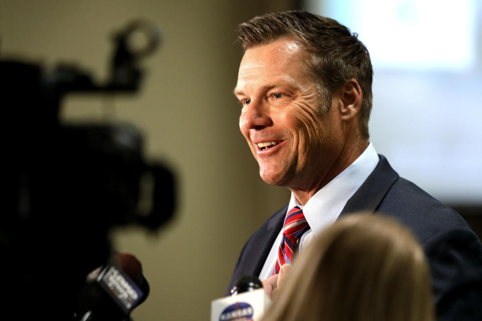 Kris Kobach, a candidate for the Republican nomination for U.S. Senate, talks with reporters at his primary watch party in Leavenworth, Kan., Tuesday, Aug. 4, 2020. (AP Photo/Orlin Wagner)