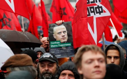 People attend a rally to demand the release of opposition protesters in Moscow