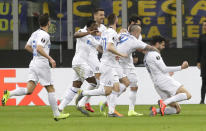 Inter Milan's Andrea Ranocchia, right, celebrates after scoring the second goal for his team during the Europa League, round of 32, second leg soccer match between Inter Milan and SK Rapid Vienna, at the San Siro stadium in Milan, Italy, Thursday, Feb. 21, 2019. (AP Photo/Luca Bruno)