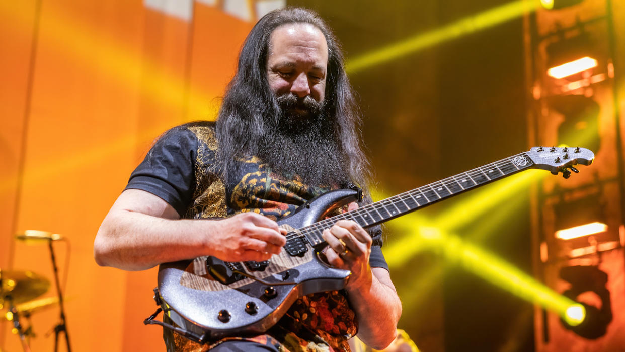  John Petrucci of Dream Theater plays an electric guitar. 
