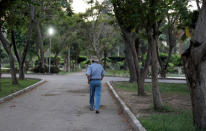 An Iraqi refugee and former interpreter for the U.S. Army in Iraq walks in a garden on the outskirts of Cairo, Egypt August 8, 2018. REUTERS/Staff