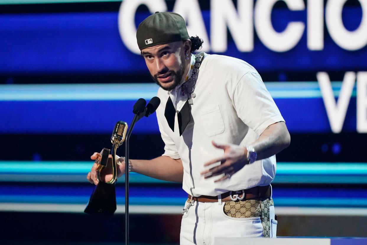 Singer Bad Bunny holds the award for the Song of the Year Sales during the Latin Billboard Awards, Thursday, Oct. 5, 2023, in Coral Gables, Fla. (AP Photo/Marta Lavandier) ORG XMIT: FLML114