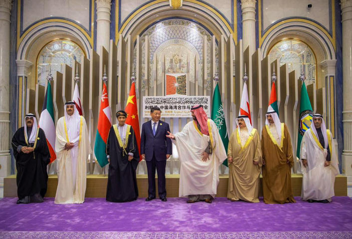 In this photo made available by Saudi Press Agency, SPA, With the presence of Arab Gulf Leaders, Saudi Crown Prince and Prime Minister Mohammed bin Salman, forth right, greets Chinese President Xi Jinping, after the group photo, during the Gulf Cooperation Council (GCC) Summit, in Riyadh, Saudi Arabia, Friday, Dec. 9, 2022. Gulf Arab leaders and others in the Mideast met Friday in Saudi Arabia as part of a state visit by Chinese leader Xi Jinping, seeking to firm up their relations with Beijing as decades of U.S. attention on the region wanes. (Saudi Press Agency via AP)