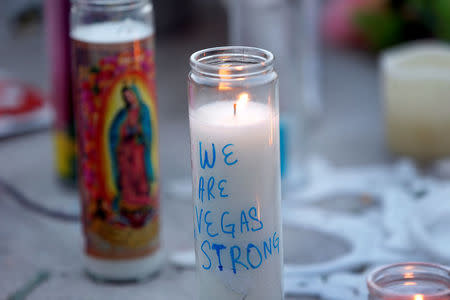 Candles are shown at a makeshift memorial during a vigil marking the one-week anniversary of the October 1 mass shooting in Las Vegas, Nevada U.S. October 8, 2017. REUTERS/Las Vegas Sun/Steve Marcus