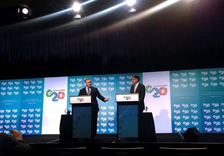 U.S. Treasury Secretary Jack Lew (R) stands with his Australian counterpart Joe Hockey during a media conference at the start of the G20 Finance Ministers and Central Bank Governors meeting in the northern Australian city of Cairns September 19, 2014. REUTERS/Lincoln Feast