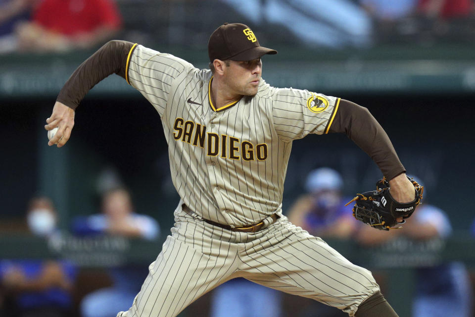 San Diego Padres pitcher Craig Stammen throws in the first inning after starting pitcher Adrian Morejon left the baseball game against the Texas Rangers on Sunday, April 11, 2021, in Arlington, Texas. (AP Photo/Richard W. Rodriguez)