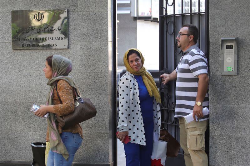 Personnel of the Embassy of the Islamic Republic of Iran leave the embassy, in Tirana