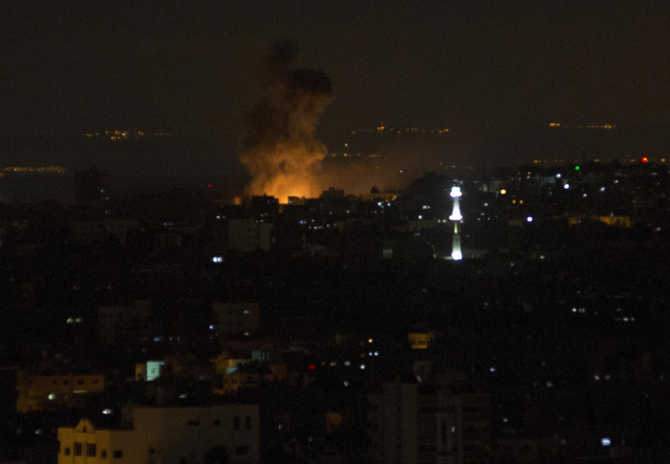 Smoke rises from an explosion caused by an Israeli airstrike on Gaza City, early Saturday, Oct. 27, 2018. Israeli aircraft struck several militant sites across the Gaza Strip early Saturday shortly after militants fired rockets into southern Israel, the Israeli military said. (AP Photo/Adel Hana)