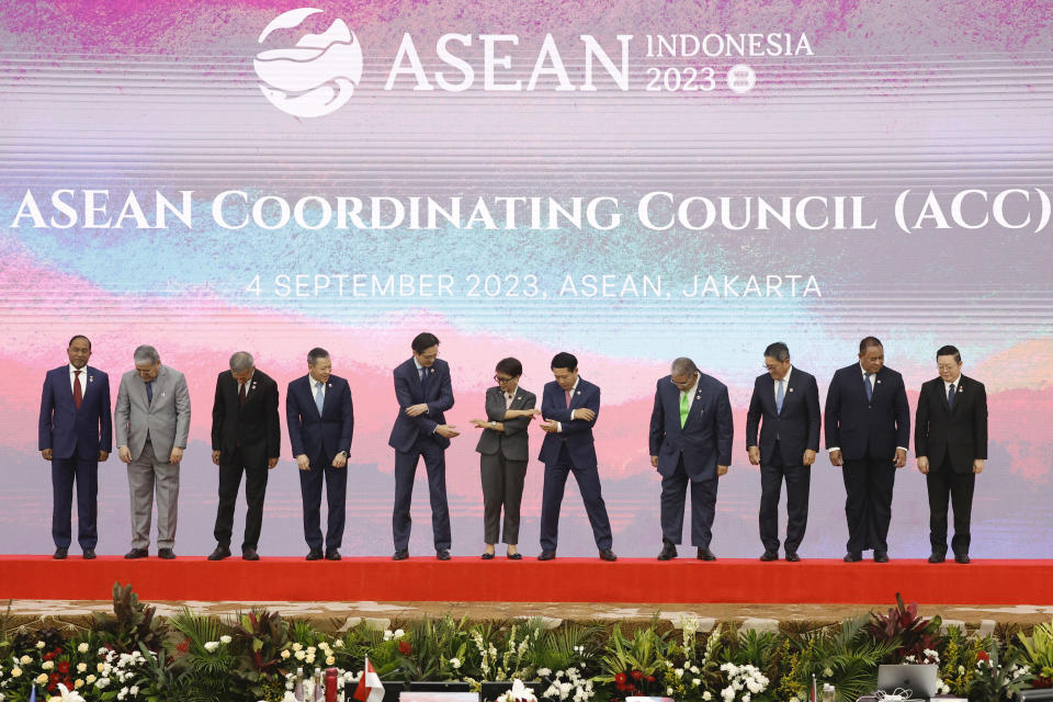 From left, Malaysia's Foreign Minister Zambry Abd Kadir, Philippines' Foreign Secretary Enrique Manalo, Singapore's Foreign Minister Vivian Balakrishnan, Thailand's Permanent Secretary of the Ministry of Foreign Affairs Sarun Charoensuwan, Vietnam's Deputy Foreign Minister Do Hung Viet, Indonesia's Foreign Minister Retno Marsudi, Laos' Foreign Minister Saleumxay Kommasith, Brunei's Foreign Minister Erywan Pehin Yusof, Cambodia's Foreign Minister Sok Chenda Sophea, East Timor's Foreign Minister Bendito dos Santos Freitas, and ASEAN Secretary General Kao Kim Hourn, prepare to hold hands for a group photo during the 34th Association of Southeast Asian Nations (ASEAN) Coordinating Council (ACC) meeting, ahead of the ASEAN Summit, at the ASEAN Secretariat in Jakarta, Indonesia, Monday, Sept. 4, 2023. (Willy Kurniawan/Pool Photo via AP)