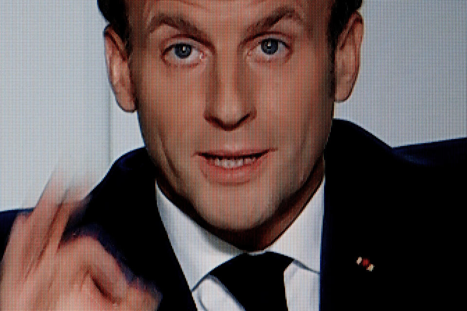 In this photo from French TV channel TF1 French President Emmanuel Macron gives a TV address to the nation in Paris, Wednesday, Oct. 28, 2020. Macron has announced a second national lockdown in France to try to combat a second wave of the resurgent coronavirus in the country. (AP Photo/Christophe Ena)