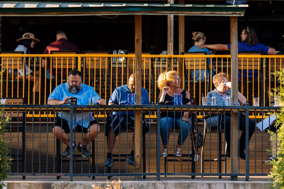 People drink at Tipsy Tiki Dockside Bar in Bricktown in Downtown Oklahoma City, on Saturday, Sept. 9, 2023.