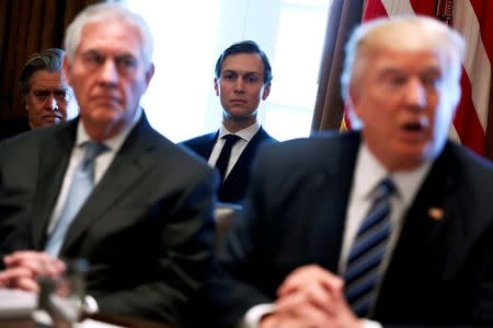 FILE PHOTO: White House advisor Jared Kushner (C) looks on as U.S. President Donald Trump (R), flanked by Secretary of State Rex Tillerson (2nd L), holds a cabinet meeting at the White House in Washington, U.S., March 13, 2017. REUTERS/Jonathan Ernst/Files